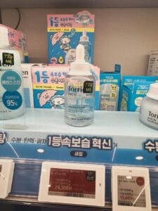 Olive Young Seoul shelf with Korean skincare price tags — Torriden Dive-In serum