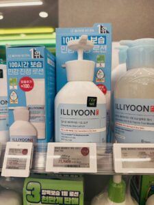 ILLIYOON Ceramide Ato Lotion 600ml on the Olive Young shelf in Seoul, with the four-year No.1 header and electronic price labels
