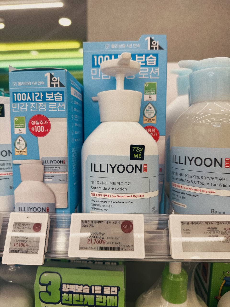 ILLIYOON Ceramide Ato Lotion 600ml on the Olive Young shelf in Seoul, with the four-year No.1 header and electronic price labels